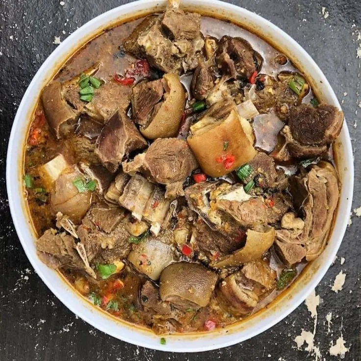 Assorted meat pepper soup in a wide white bowl