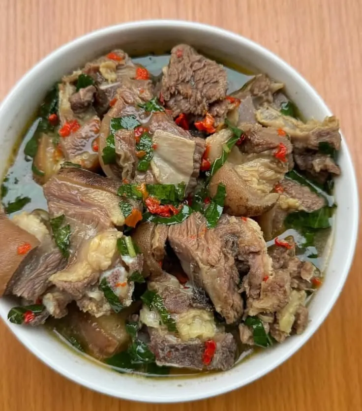 Goat meat stewed with garden egg and greens